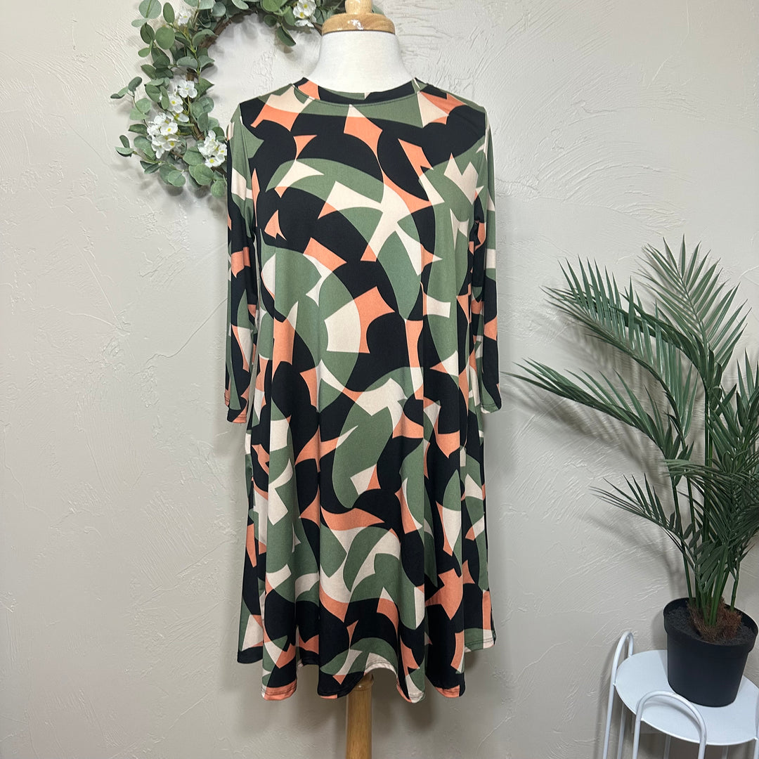Liza Lou’s Green Geometric Print Tunic Top
