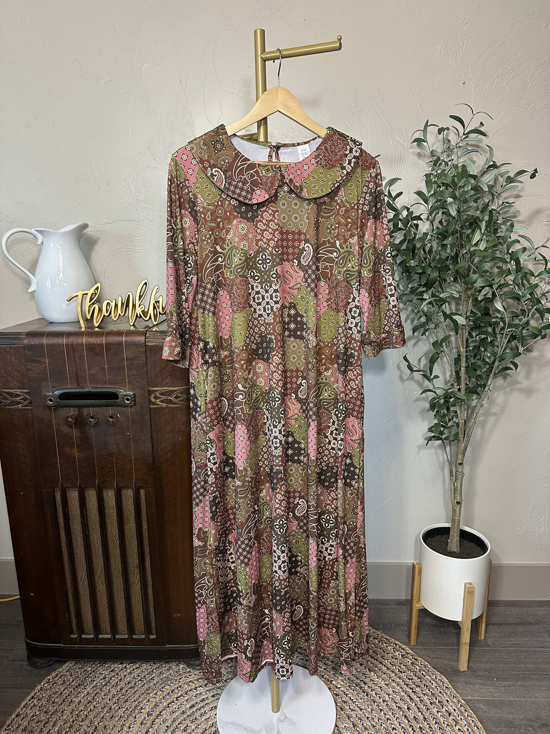 Adrianna Patchwork Dress on hanger, brown, olive and pink print, front view