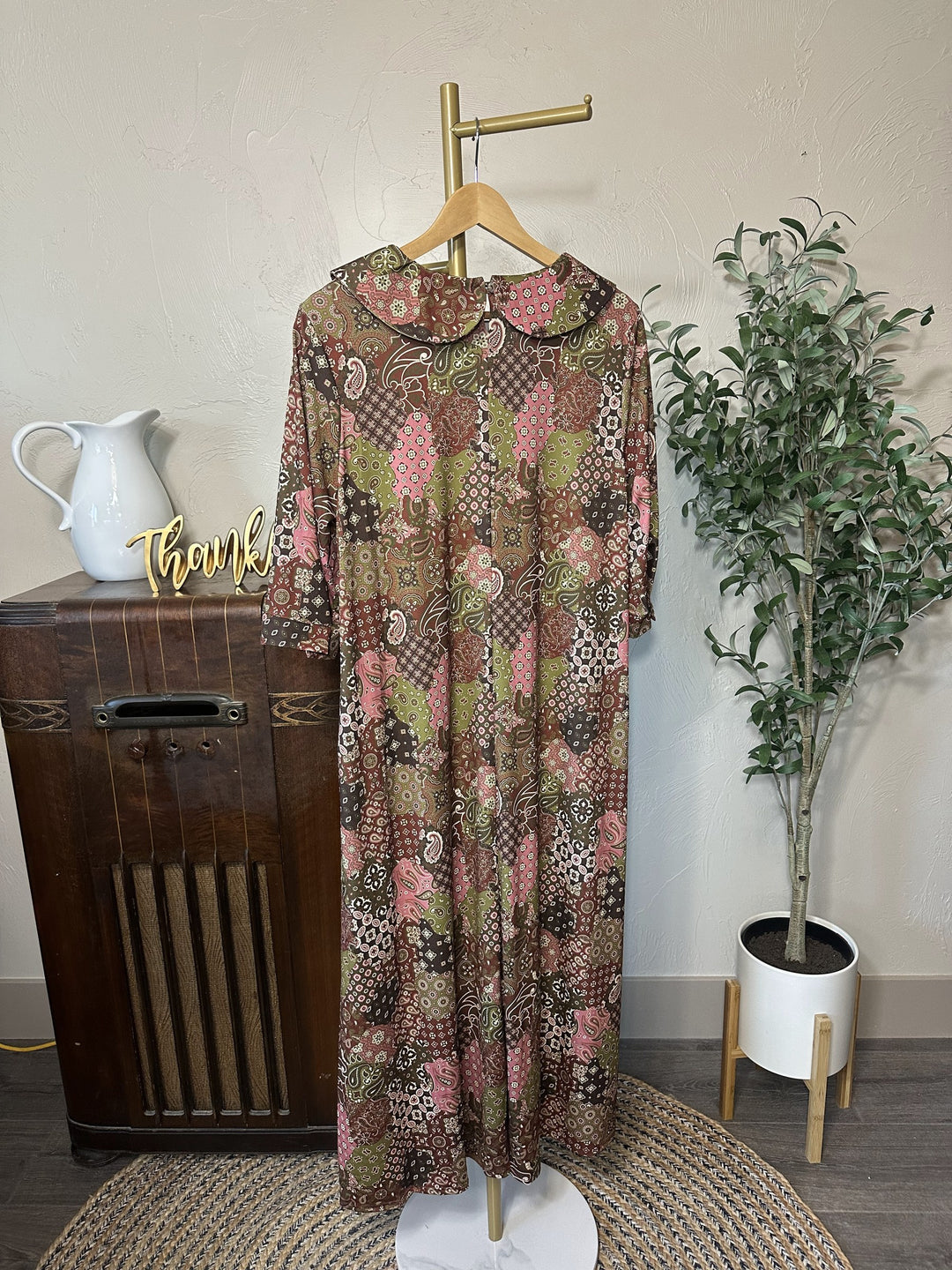 Adrianna Patchwork Dress on hanger, rounded collar and patchwork print, back view