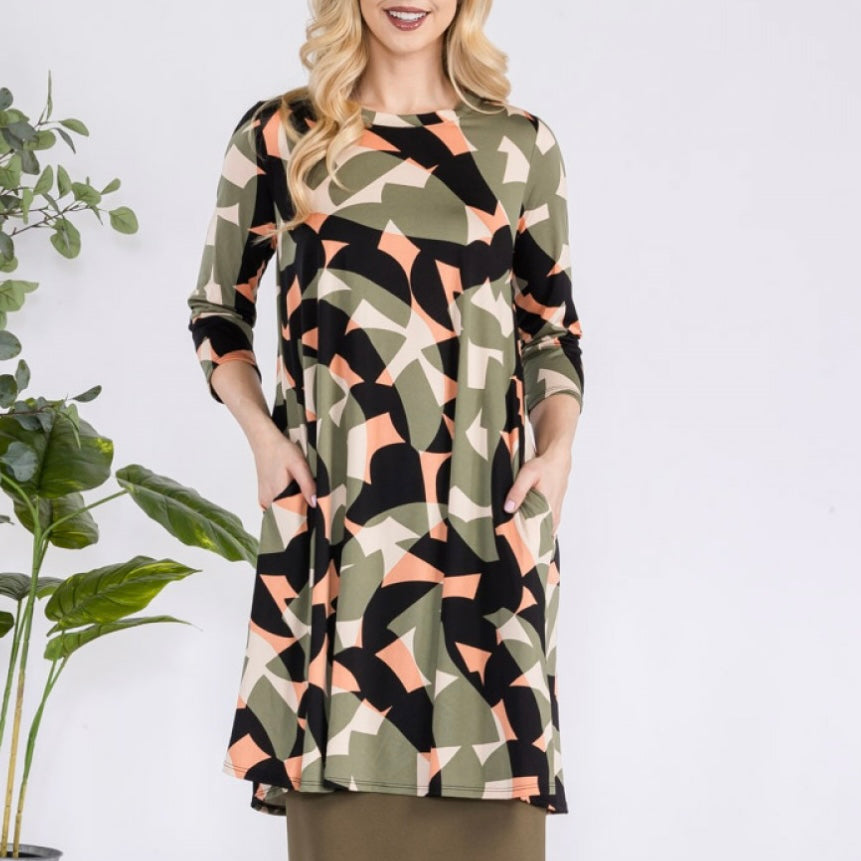 Liza Lou’s Green Geometric Print Tunic Top