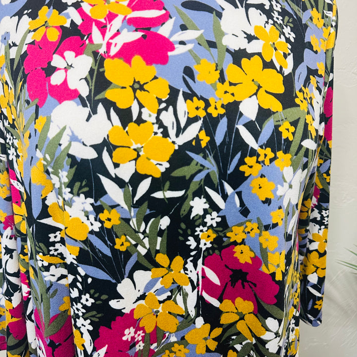 Liza Lou’s Black Background with Floral Hi Low Tunic Top with Ruffle