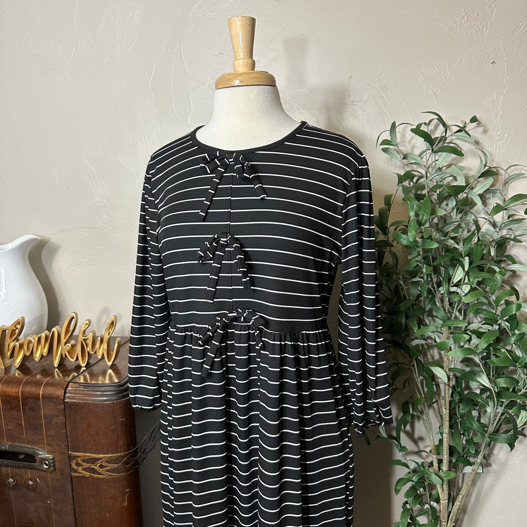 Ellie Triple Bow Striped Dress in black, gathered sleeves, angled bodice view