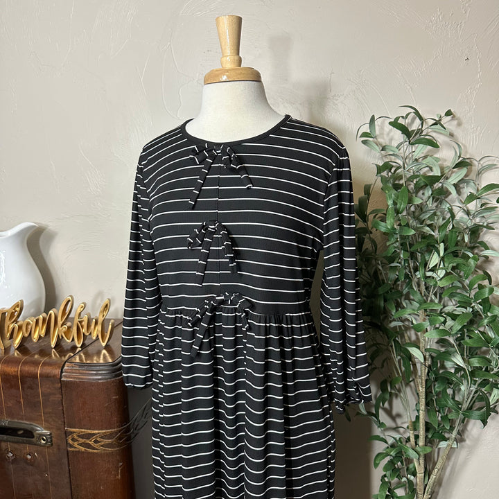 Ellie Triple Bow Striped Dress in black, gathered sleeves, angled bodice view