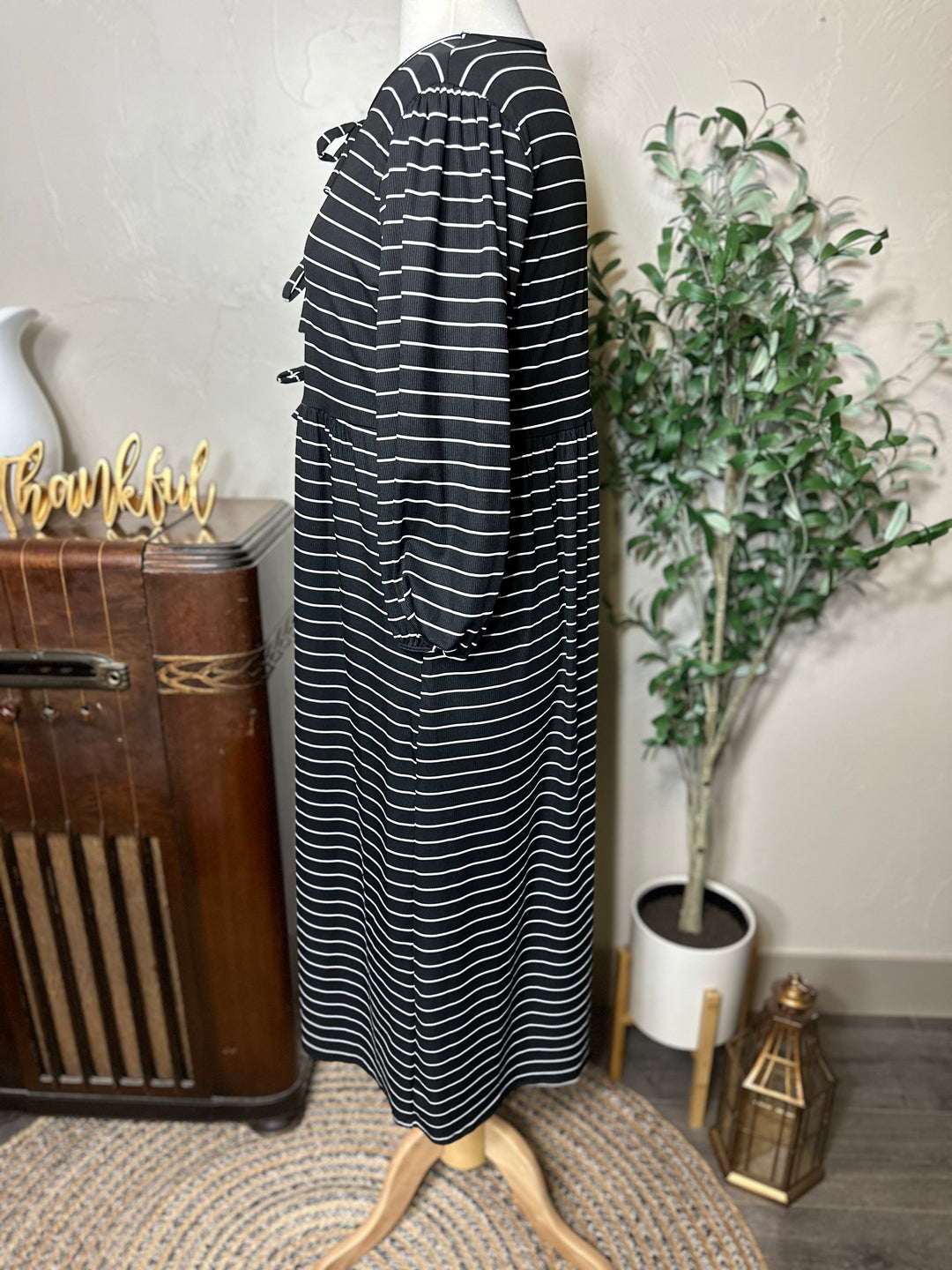 Ellie Triple Bow Striped Dress in black, modest length with pockets, side view