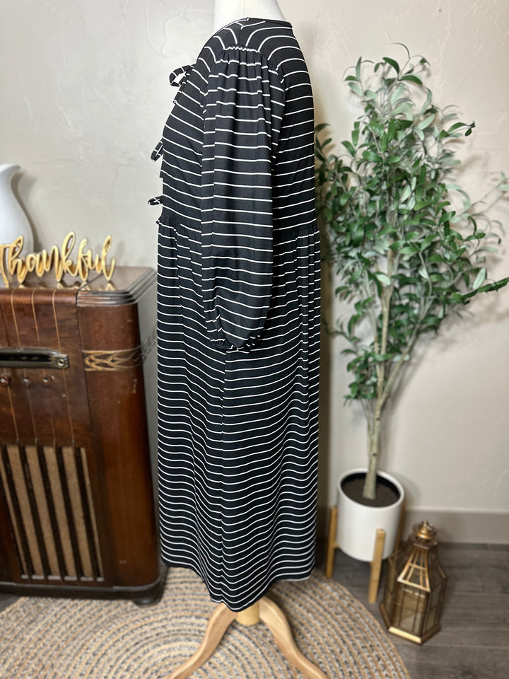 Ellie Triple Bow Striped Dress in black, modest length with pockets, side view