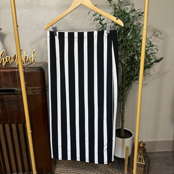 Juliette Pull-On Midi Skirt in black and cream stripes, wide vertical stripe, front view on hanger