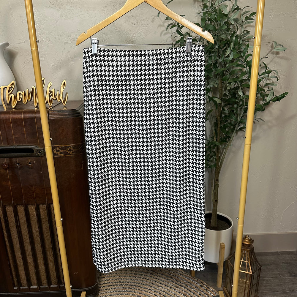 Juliette Pull-On Midi Skirt in black and white houndstooth, elastic waist, front view on hanger