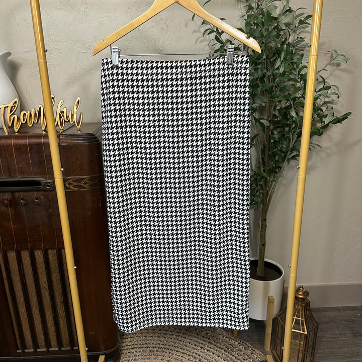 Juliette Pull-On Midi Skirt in black and white houndstooth, elastic waist, front view on hanger