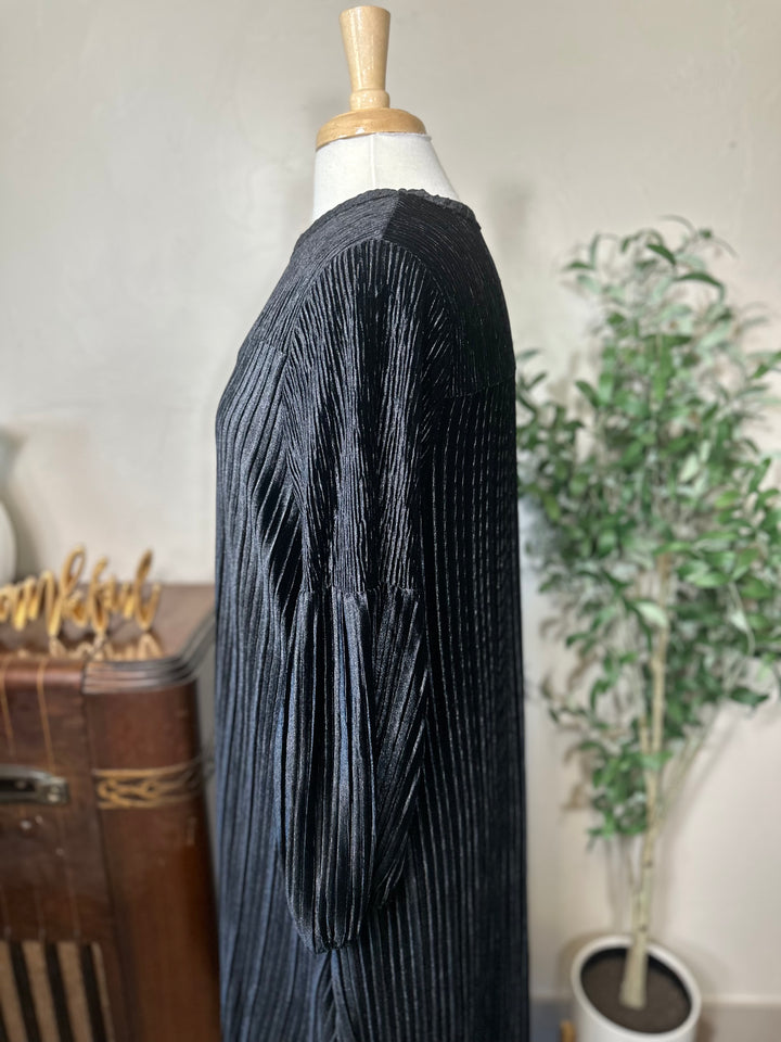 Evelyn Pleated Velvet Midi Dress in black, full sleeve gathered at wrist, side close-up