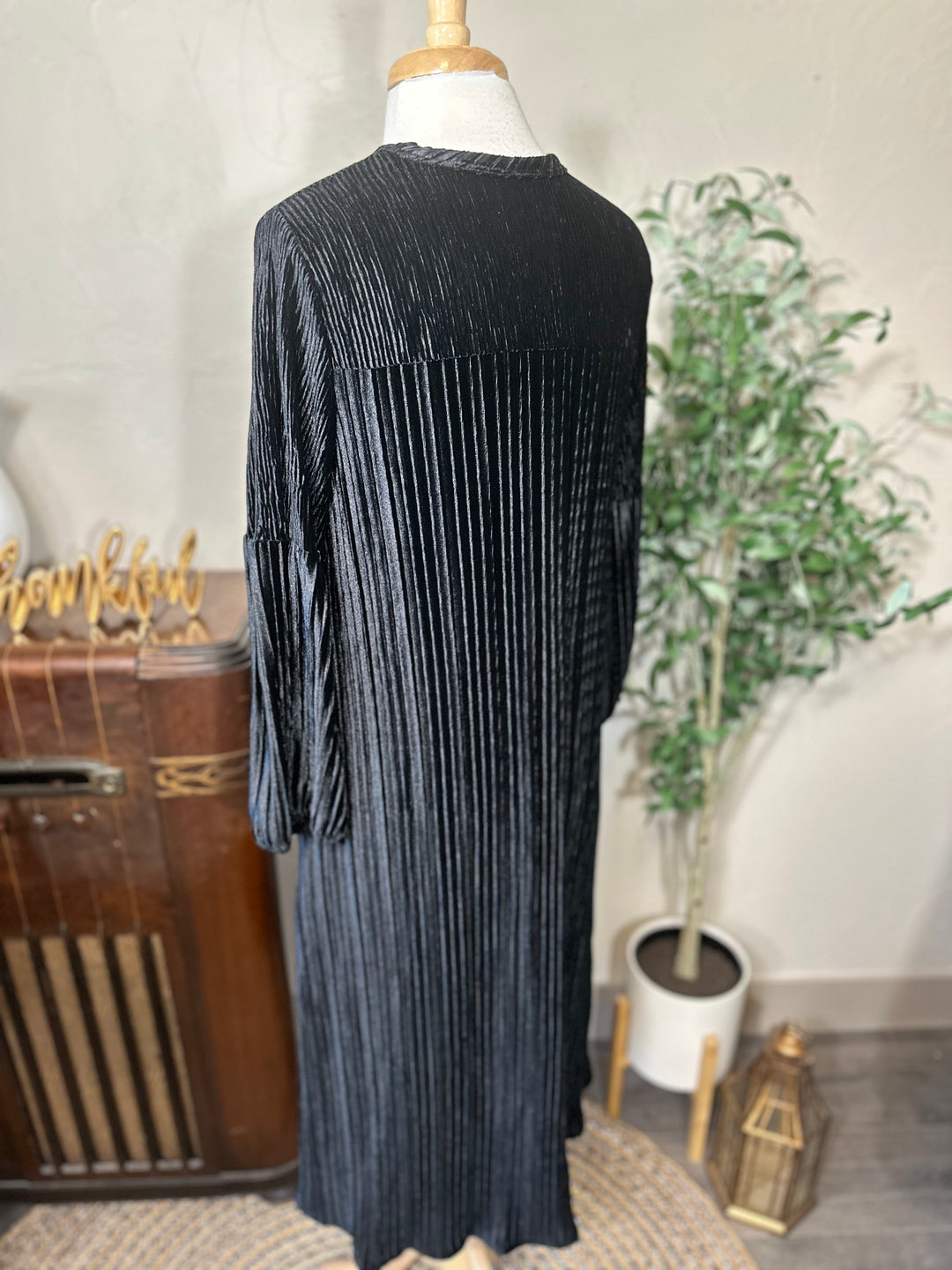 Evelyn Pleated Velvet Midi Dress in black, full swing skirt, back three-quarter view