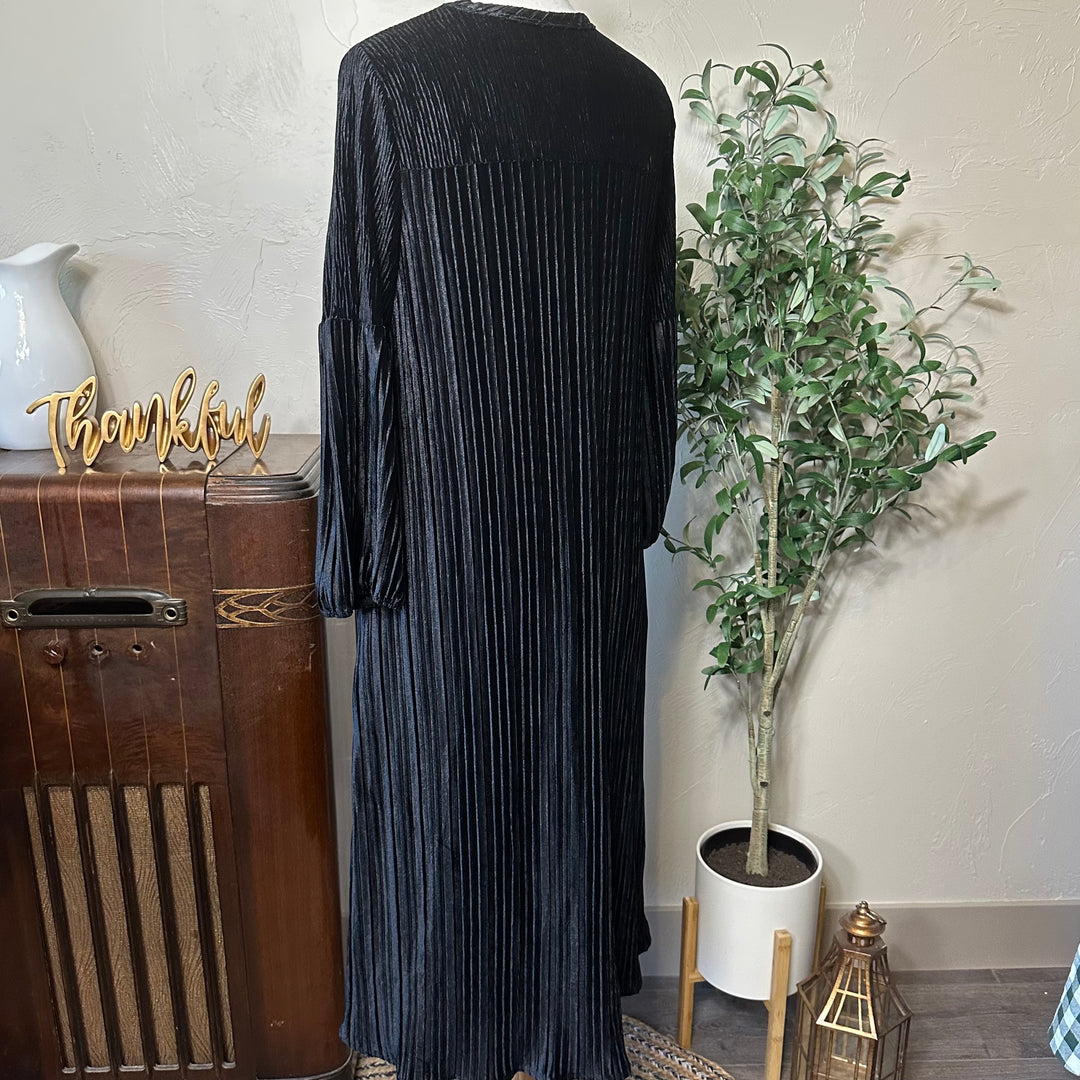 Evelyn Pleated Velvet Midi Dress in black, gathered cuffs, back three-quarter view