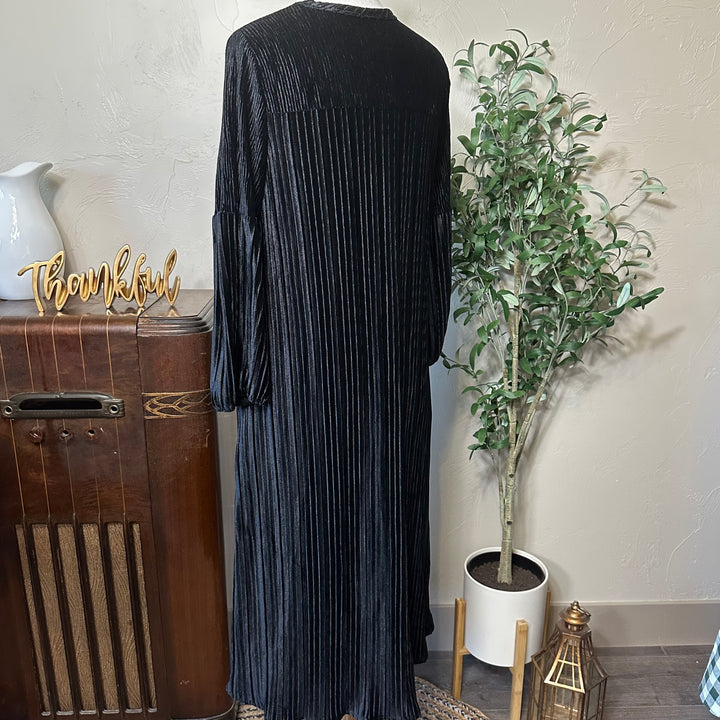 Evelyn Pleated Velvet Midi Dress in black, gathered cuffs, back three-quarter view