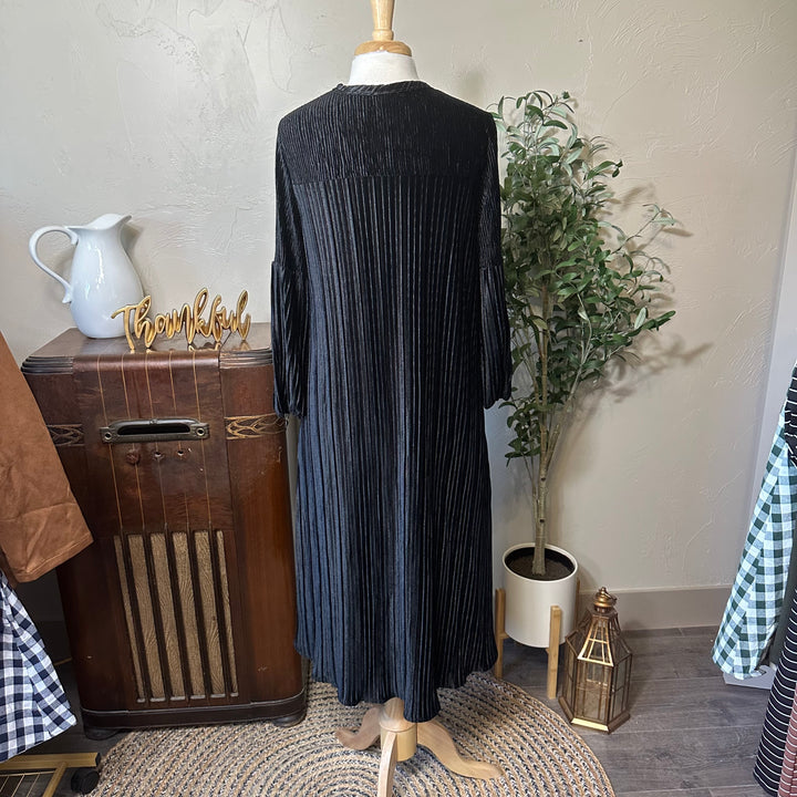 Evelyn Pleated Velvet Midi Dress in black, midi length, back view