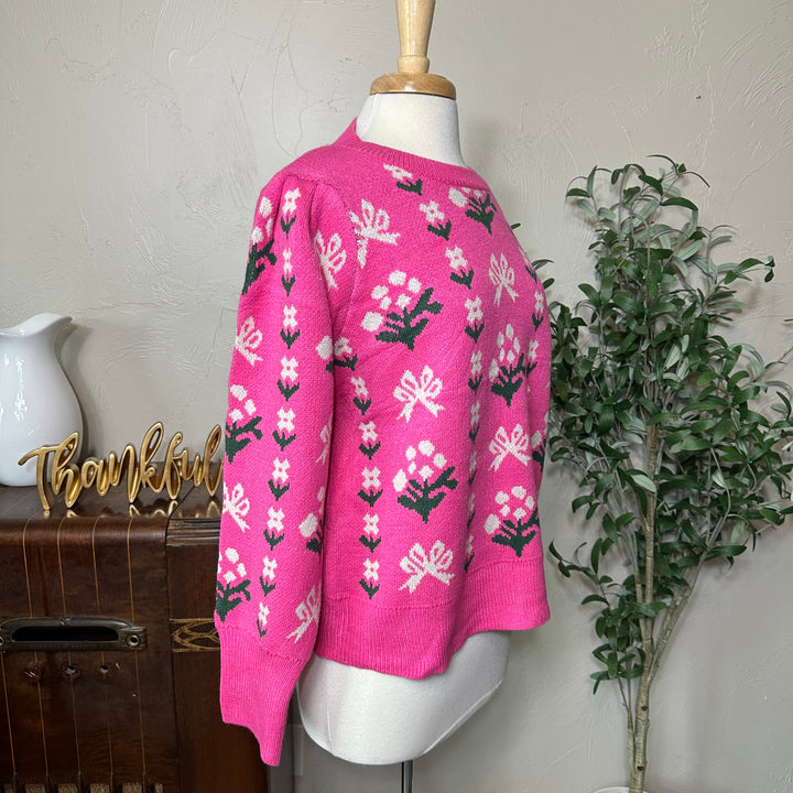 Rosie Bow and Flower Pullover Sweater in pink, gathered shoulder, three-quarter side view