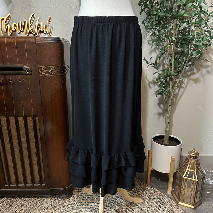 Hattie Tiered Ruffle Skirt in black, ruffle hem, angled view
