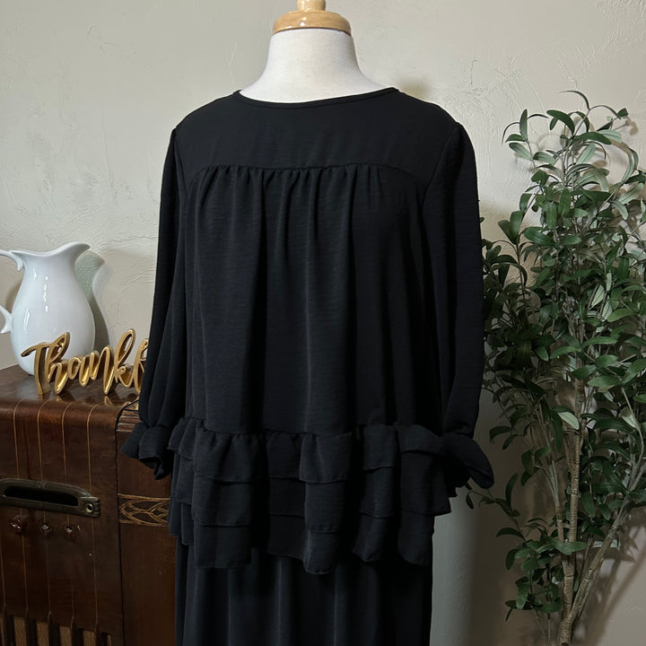 Hattie Tiered Ruffle Top in black, round neck and gathered yoke, front view