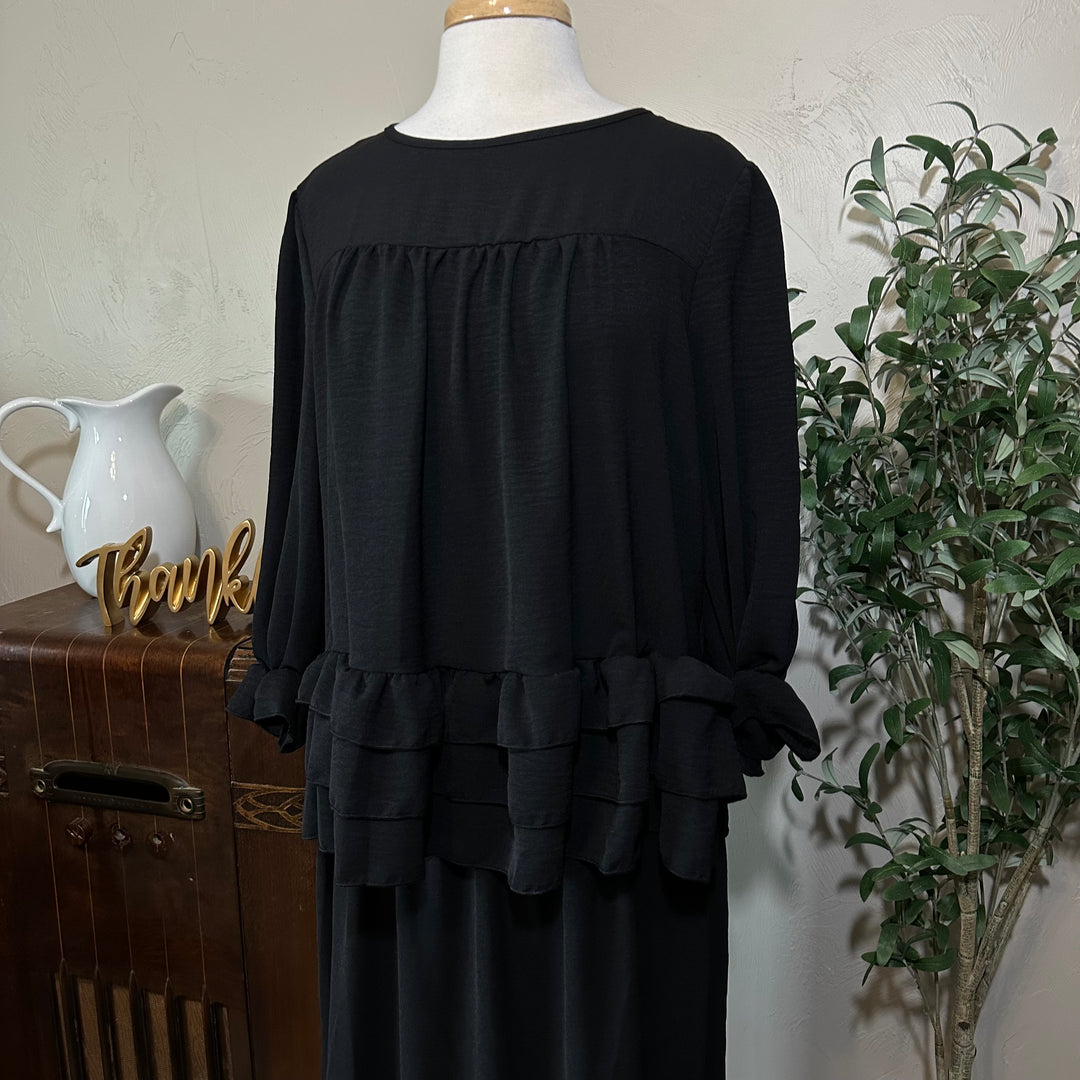 Hattie Tiered Ruffle Top in black, ruffled cuffs, front close-up
