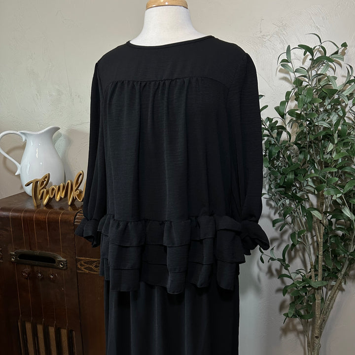 Hattie Tiered Ruffle Top in black, ruffled cuffs, front close-up