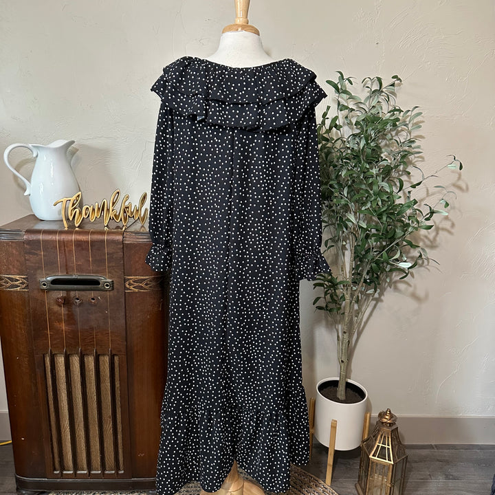 Second back view of the polka dot dress, full length with ruffle hem