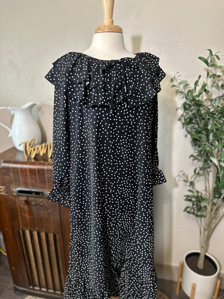 Closer front view of the polka dot dress from the ruffle collar to the ruffle hem