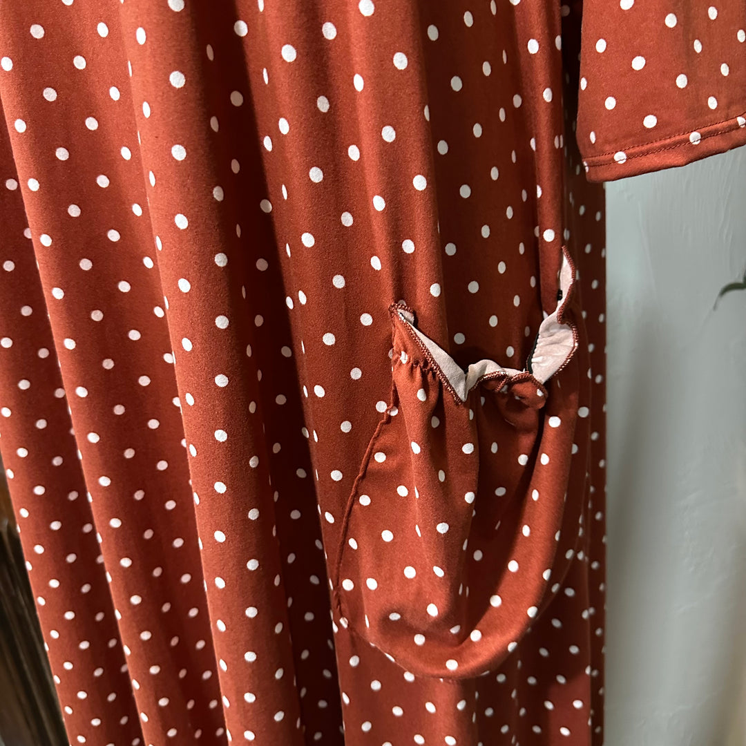 Ginny Peter Pan Collar Polka Dot Dress in rust, gathered pocket with blush ruffle trim, close-up