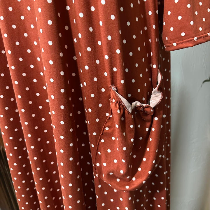 Ginny Peter Pan Collar Polka Dot Dress in rust, gathered pocket with blush ruffle trim, close-up