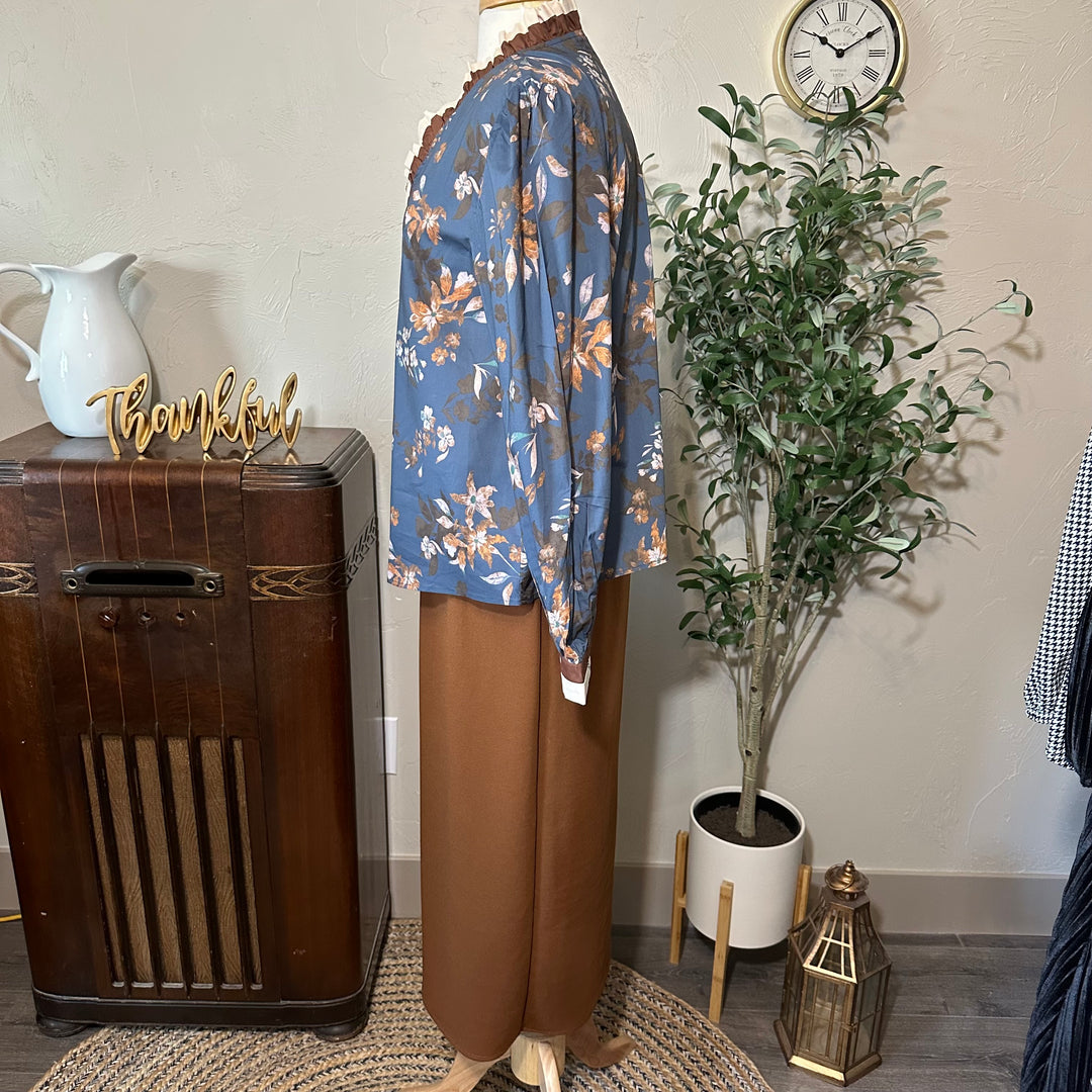 Side profile of the floral blouse and brown midi skirt outfit