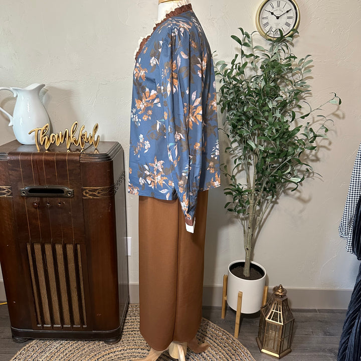 Side profile of the floral blouse and brown midi skirt outfit