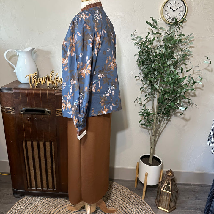 Other side profile of the Eleanor blouse with a brown midi skirt