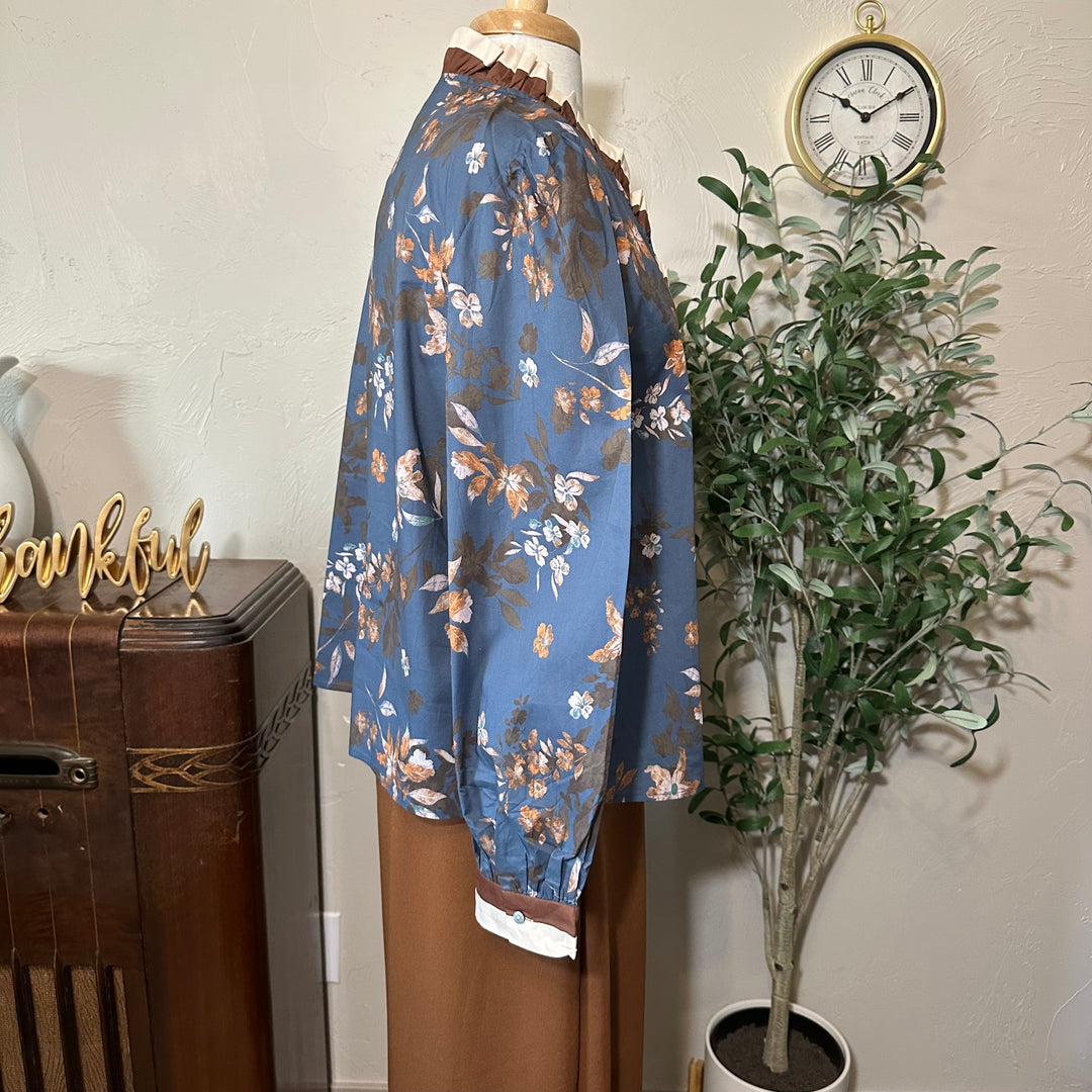 Side view showing the full long sleeve and buttoned cuff